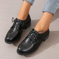 Black women's leather work shoes with thick chunky heel and pointed toe