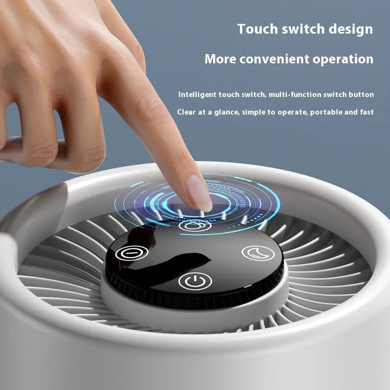 White simple-style desktop air purifier with USB cable on a wooden desk.