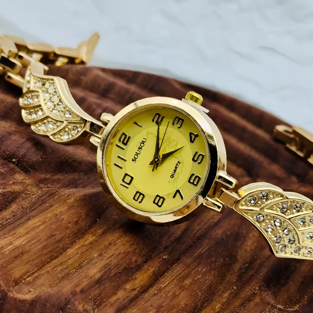Women's stainless steel watch with round gold surface dial and vachette clasp
