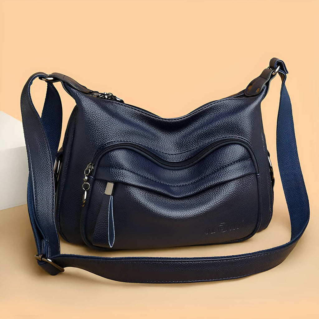 Large blue soft PU women's shoulder bag with a zipper and organised interior compartments.