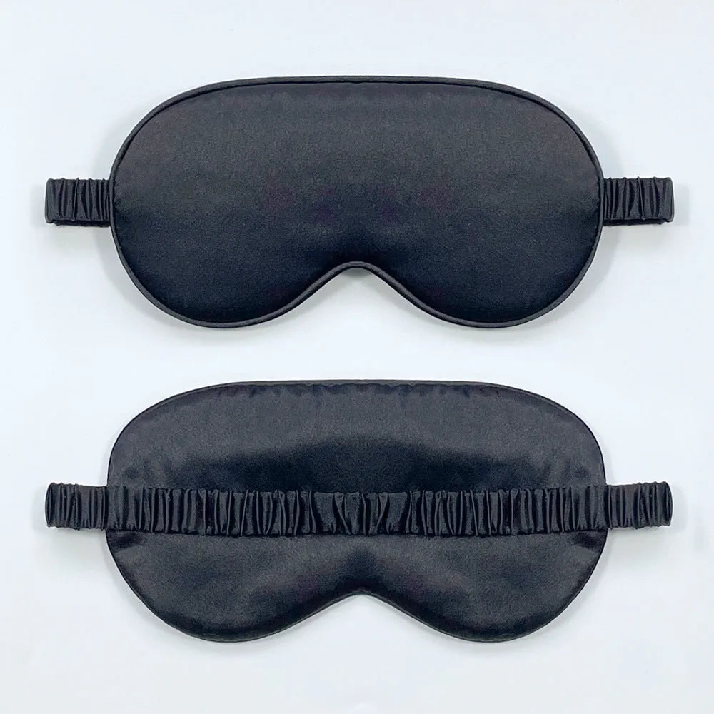 Double-sided silk-like sleep mask in rayon satin, shown in multiple colour options on a white background.