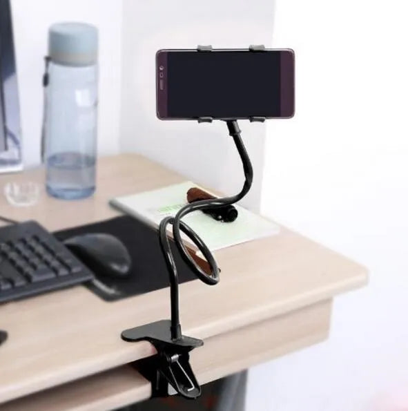 Black flexible long arm phone stand with V-clip holder extended on a desk