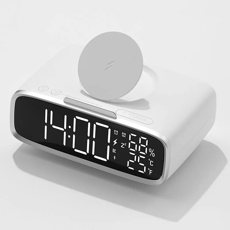 White wireless charger Bluetooth speaker with night light on desk beside smartphone