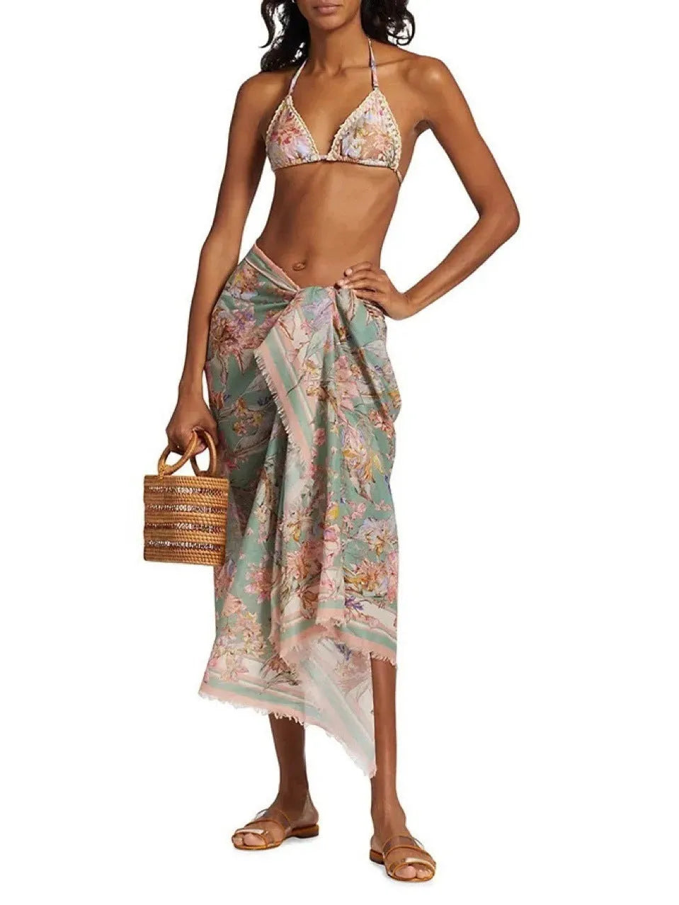 Creamy-white floral patterned women's three-piece bikini set with skirt.
