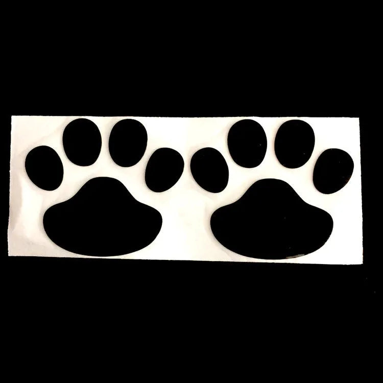 PVC car sticker with hand-shaped brush dog footprints design on a car bumper.