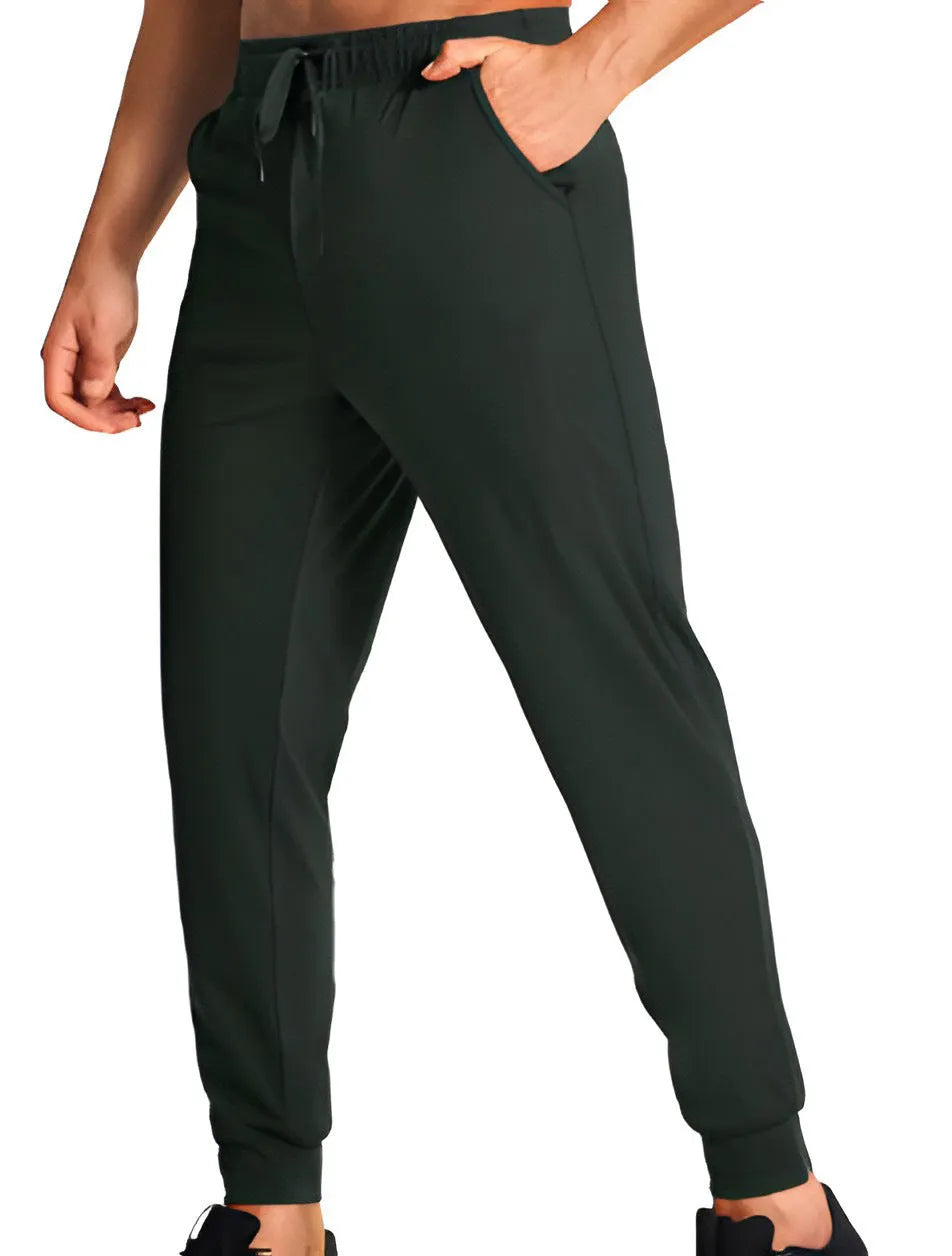 Men's loose fit solid colour casual trousers in polyester fabric on a hanger