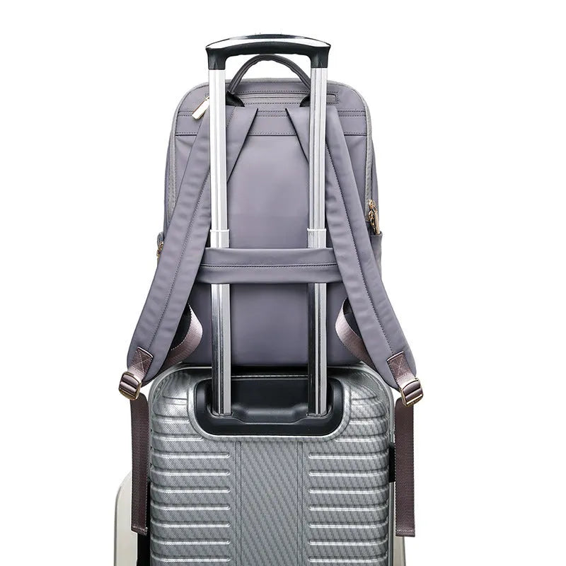 Large capacity black Oxford cloth women's backpack with multiple compartments.