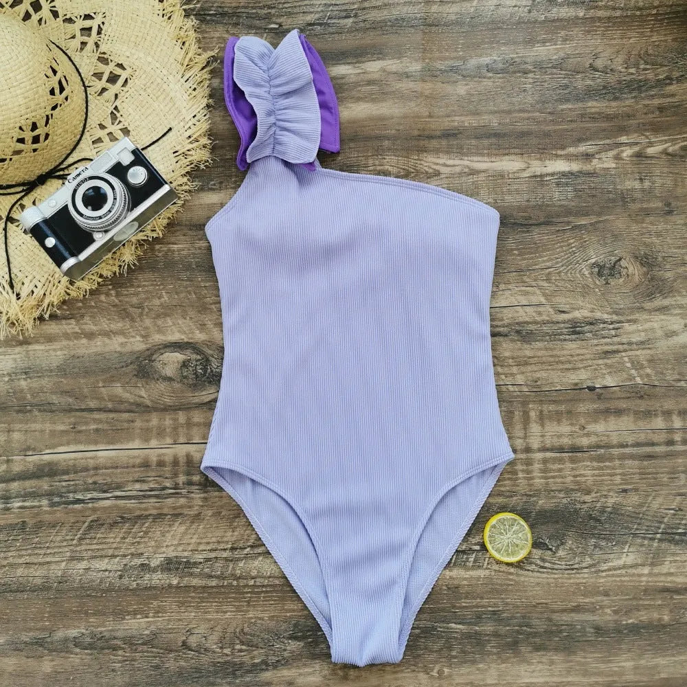 Women's single-shoulder tube top one-piece swimsuit with high waist in solid colour.