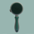 Green and pink double-sided cat brush with release button and flea comb for pet grooming