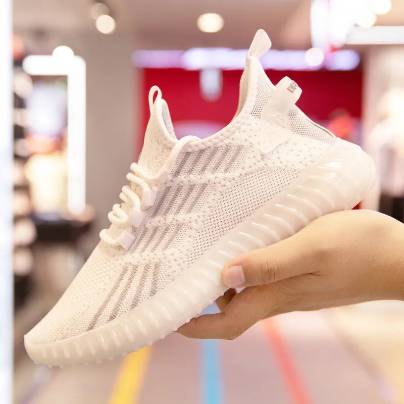 Men's white breathable flying fabric sports shoes with round toe and low-upper design.