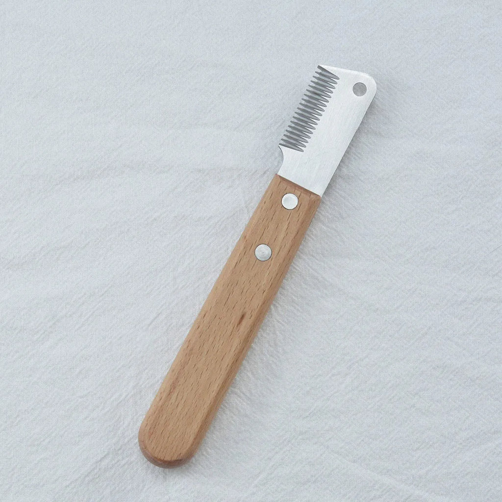 Pet stripping comb with wood handle for removing floating hair from cats and dogs