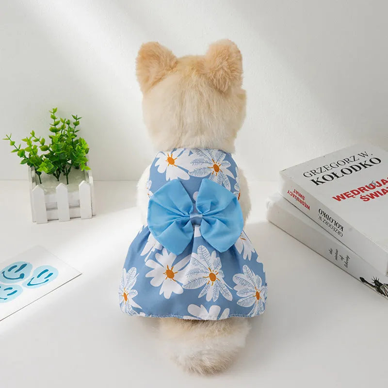 Orange bow floral butterfly pattern polyester dress on a small dog