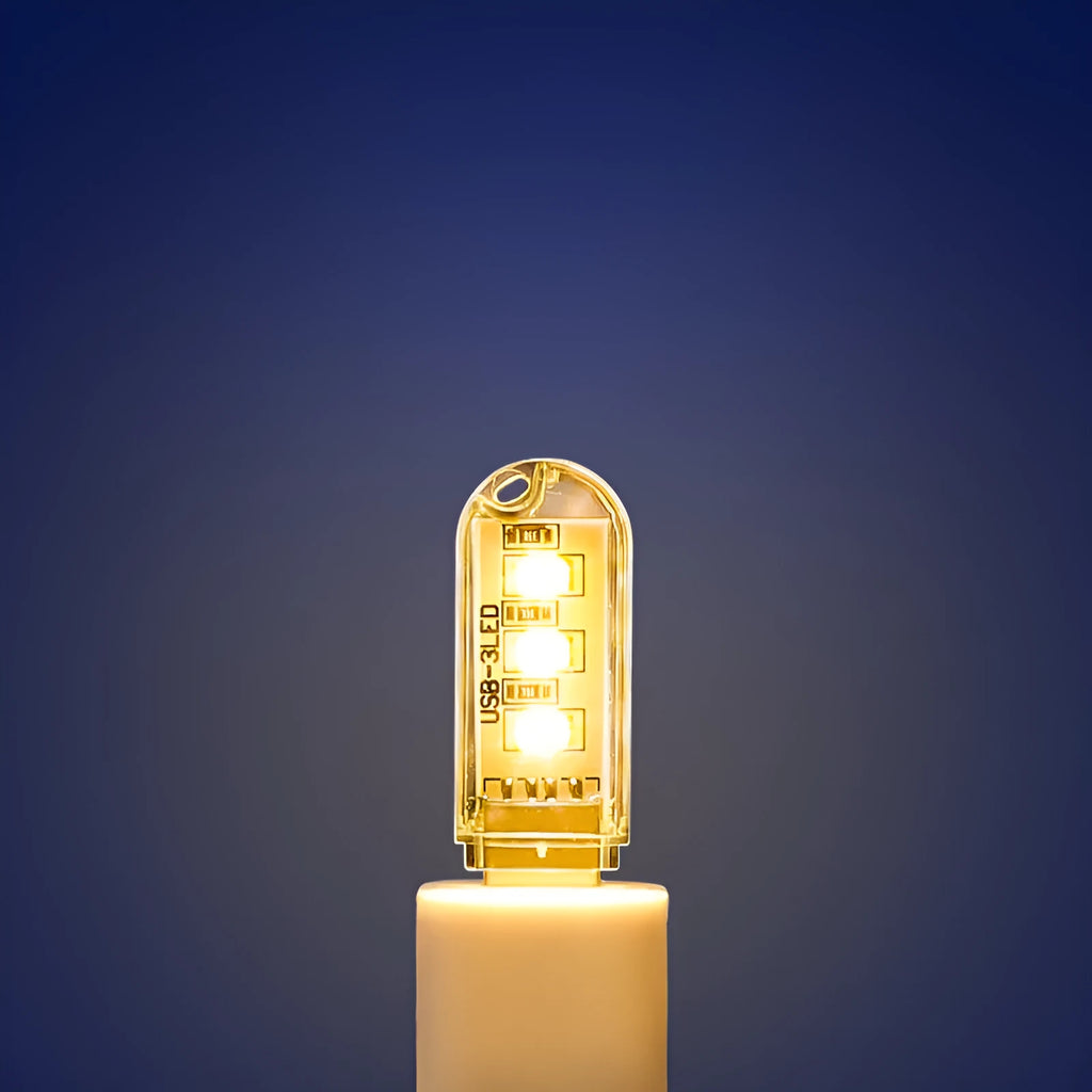 Small white USB-powered LED baby night light showing white and warm light options.