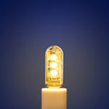 Small white USB-powered LED baby night light showing white and warm light options.
