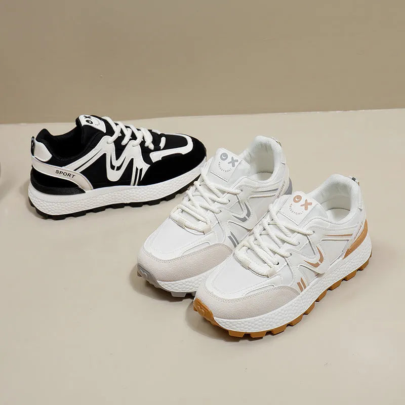 Women's black platform casual shoes with flat heel, round toe, and lace-up front on a white background.