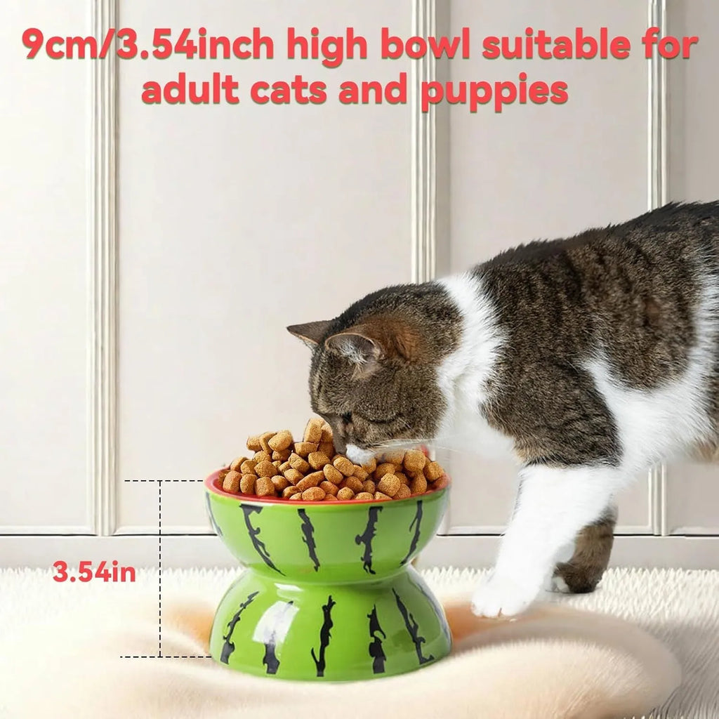 Ceramic raised cat bowl in orange pattern, showing tilted wide-rim design on elevated stand.