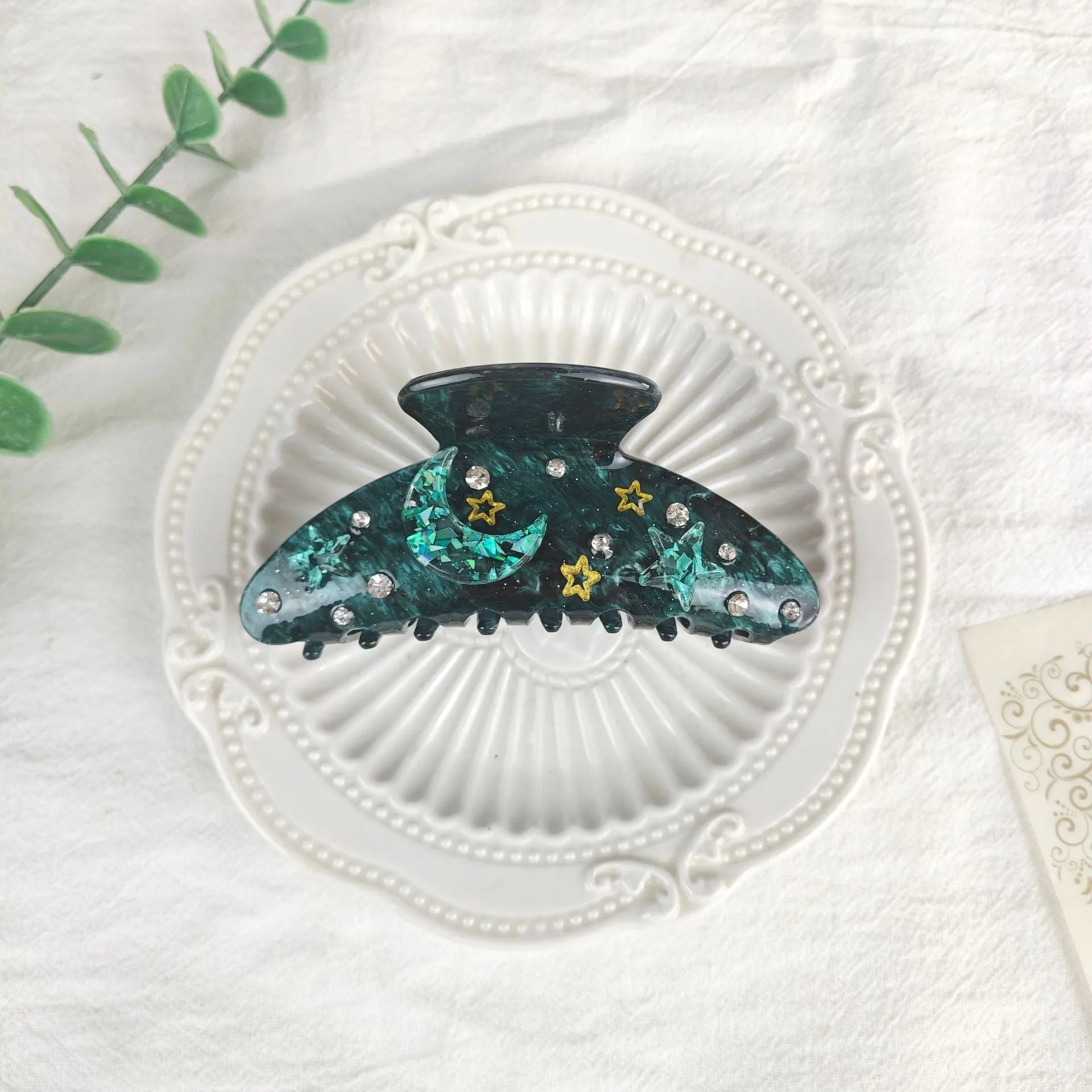 Oversized star moon barrettes with starry sky patterns in multiple colour options