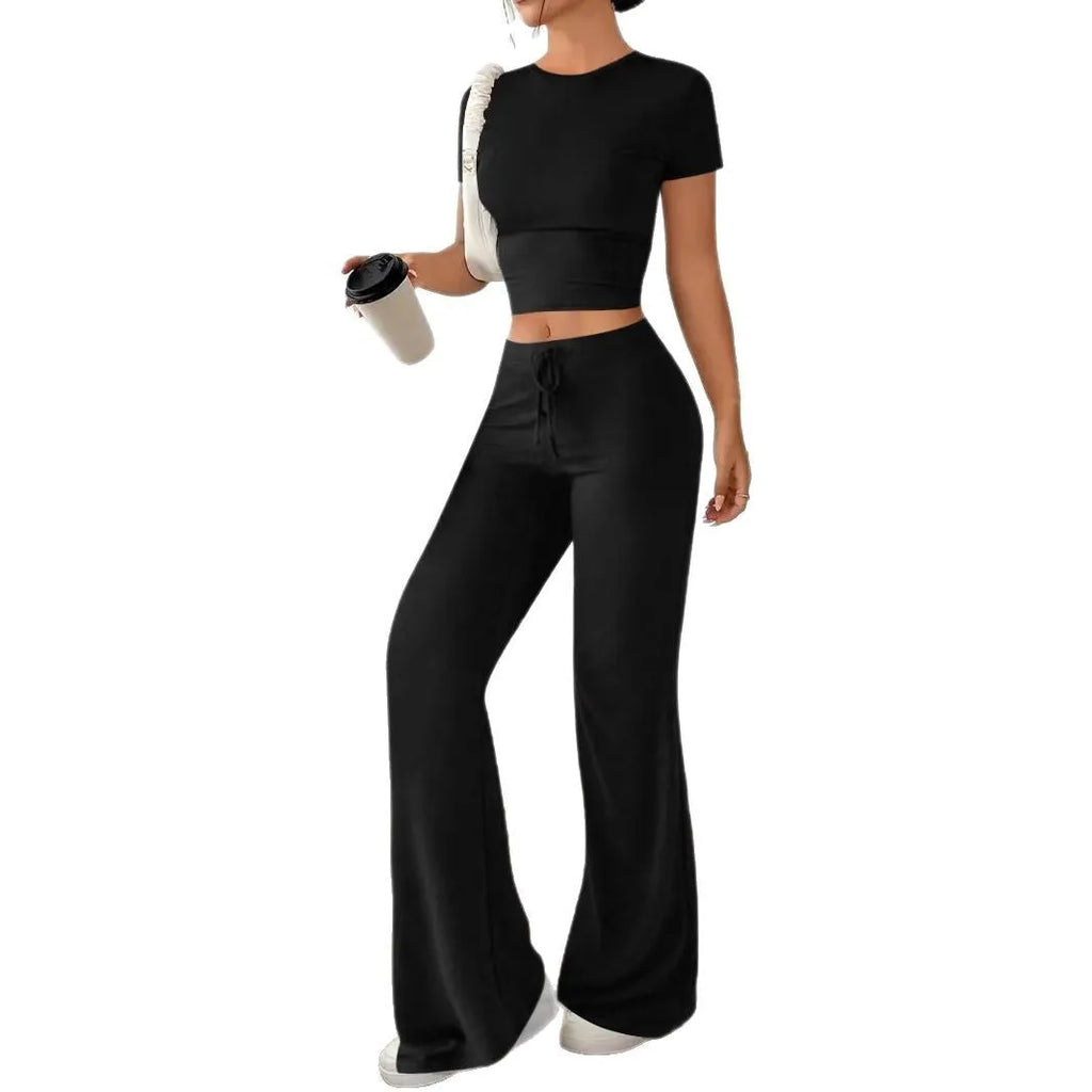 Women's black polyester trouser and T-shirt co-ord set showing complete outfit