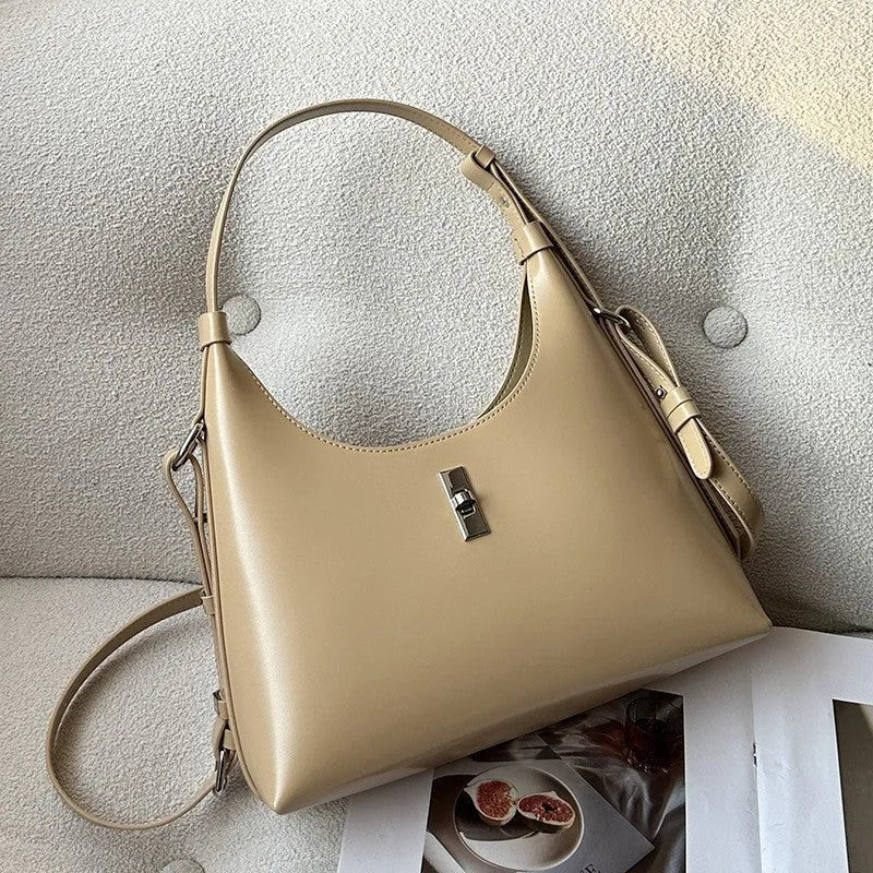 Soft genuine leather dumpling-shaped crossbody shoulder bag in a street style with lock detail