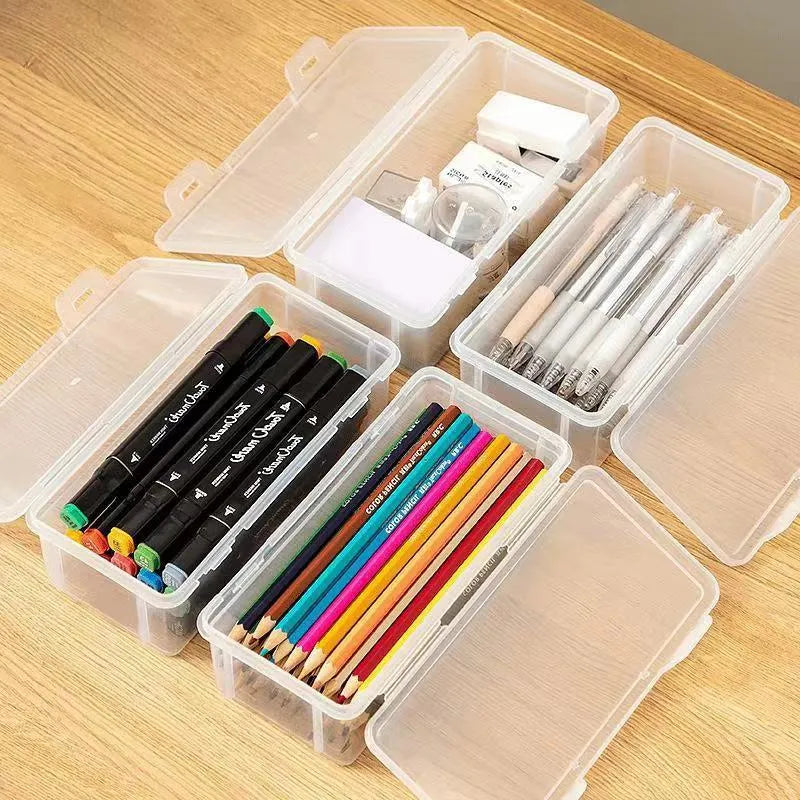 Clear plastic storage box for pencils, colouring leads, and children's crayons on a desk.