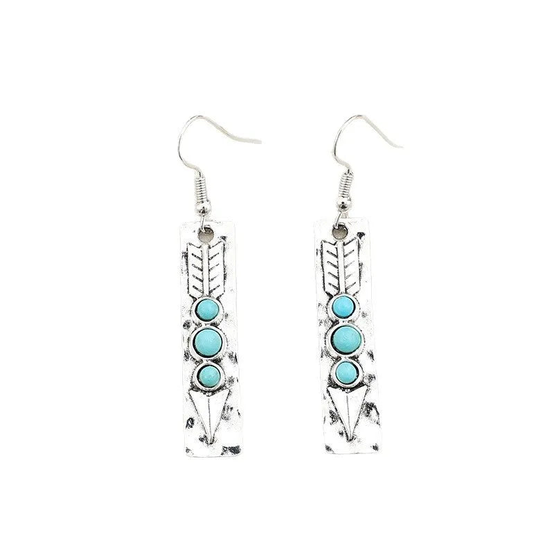Silver geometric earrings with a long strip design and a blue turquoise inlay
