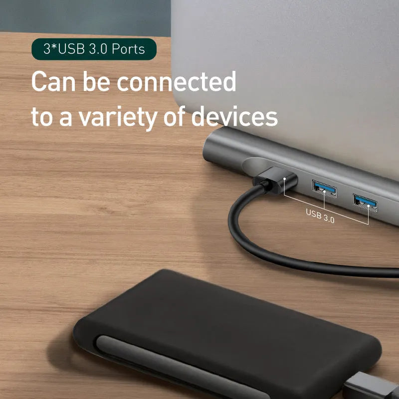 Grey ten-port USB-C hub docking station with cooling bracket showing HDMI, VGA and Ethernet ports