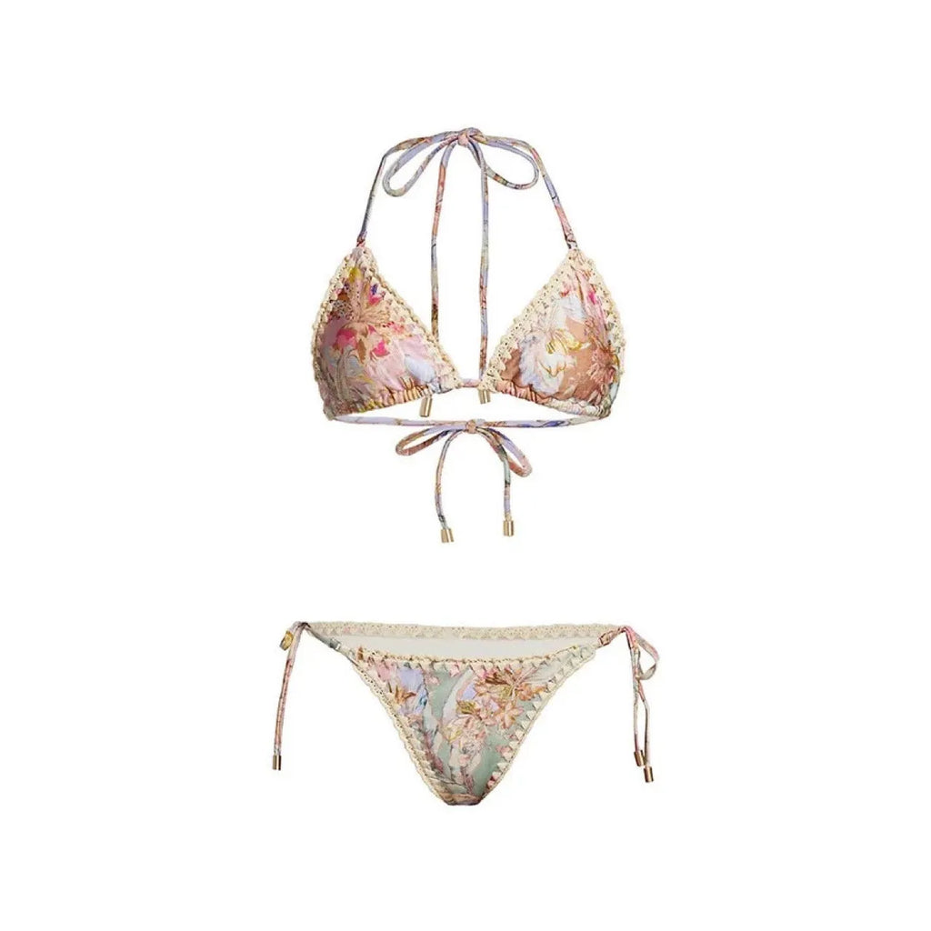 Creamy-white floral patterned women's three-piece bikini set with skirt.