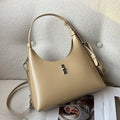 Soft genuine leather dumpling-shaped crossbody shoulder bag in a street style with lock detail