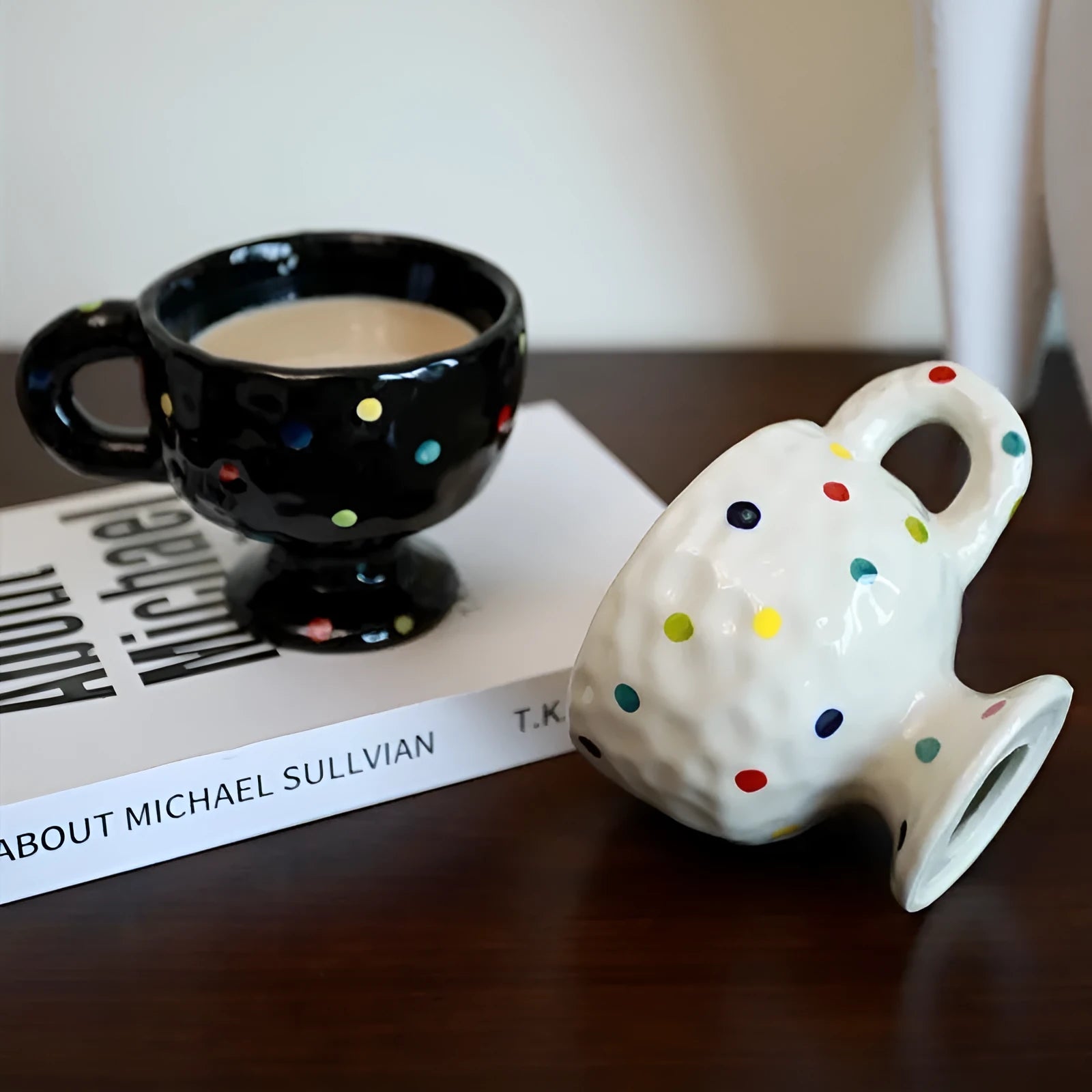 Hand-pinched irregular shaped ceramic mug in a solid colour, modern simple design