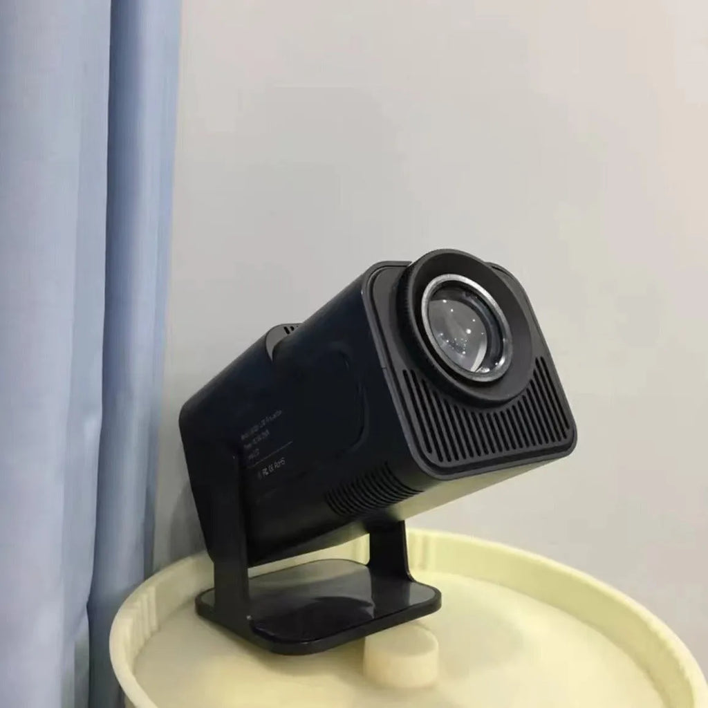 720p wireless home projector with carrying handle on white background