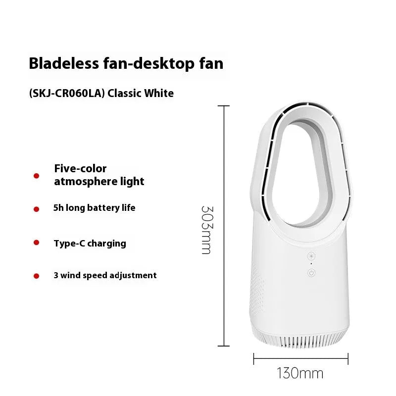 White bladeless tower fan with remote control on a wooden floor next to a desk.