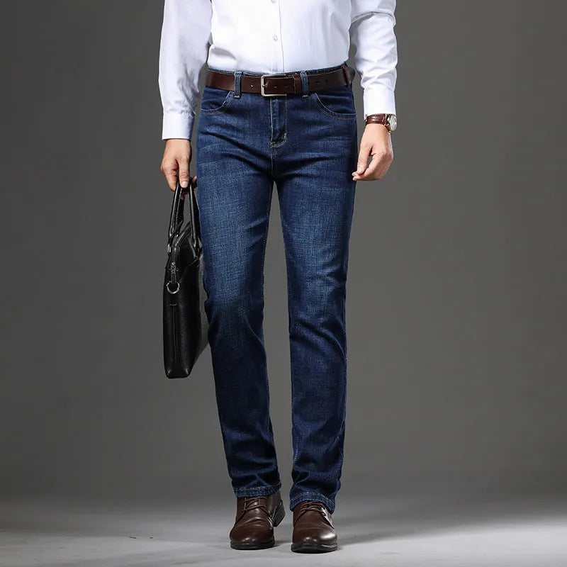 Women's straight leg stretch jeans in K276 blue denim, shown in a loose fit on a model.