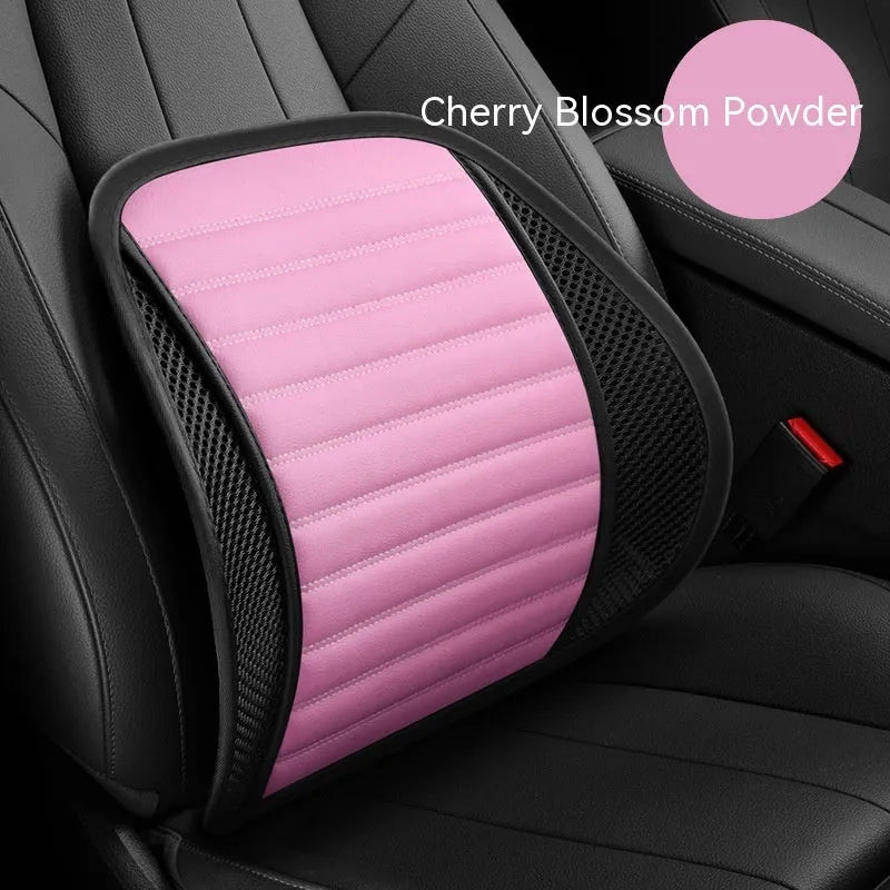 Leather lumbar support cushion with removable memory foam pad in sapphire blue colour on a car seat.