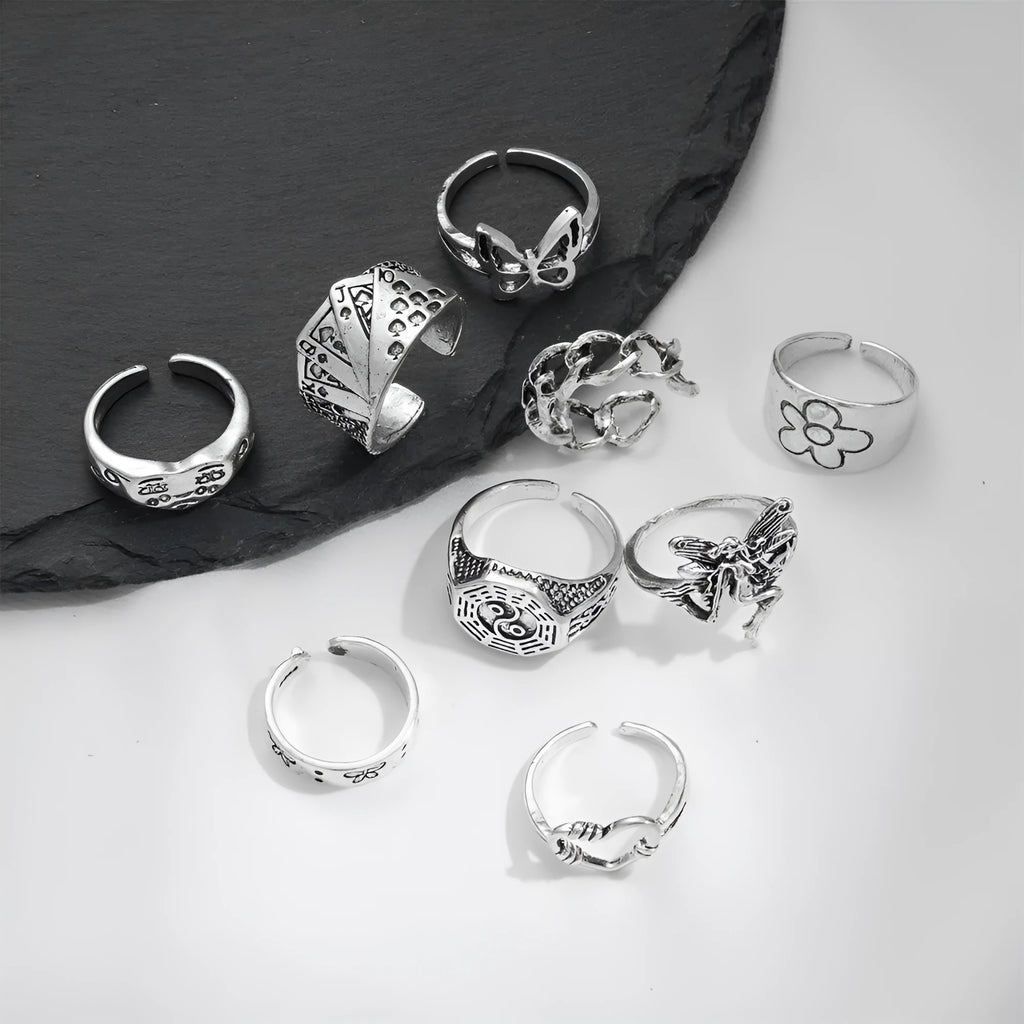 Alloy ring set with butterfly and snake retro geometric designs on display