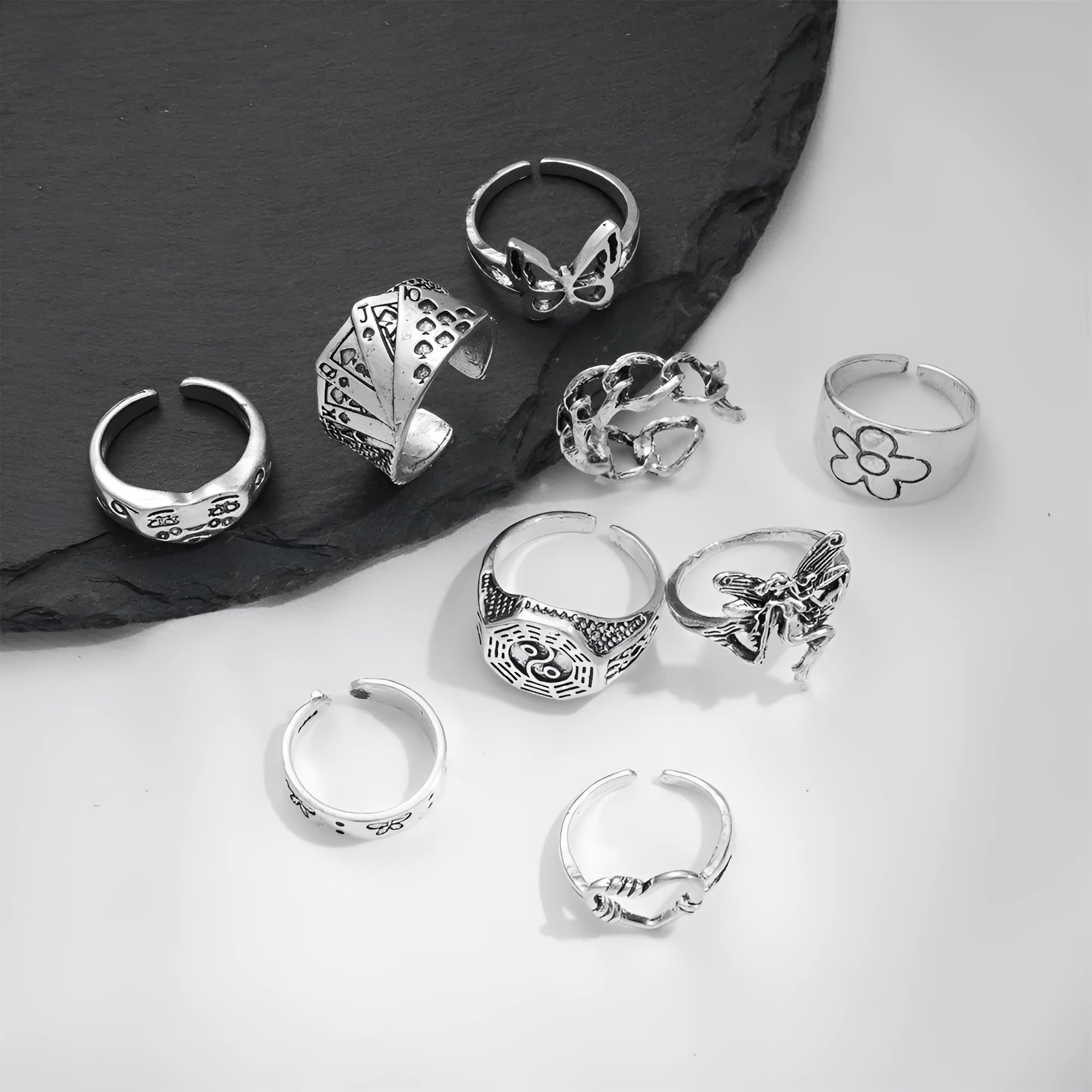 Alloy ring set with butterfly and snake retro geometric designs on display