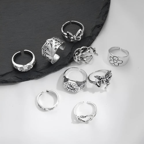 Alloy ring set with butterfly and snake retro geometric designs on display