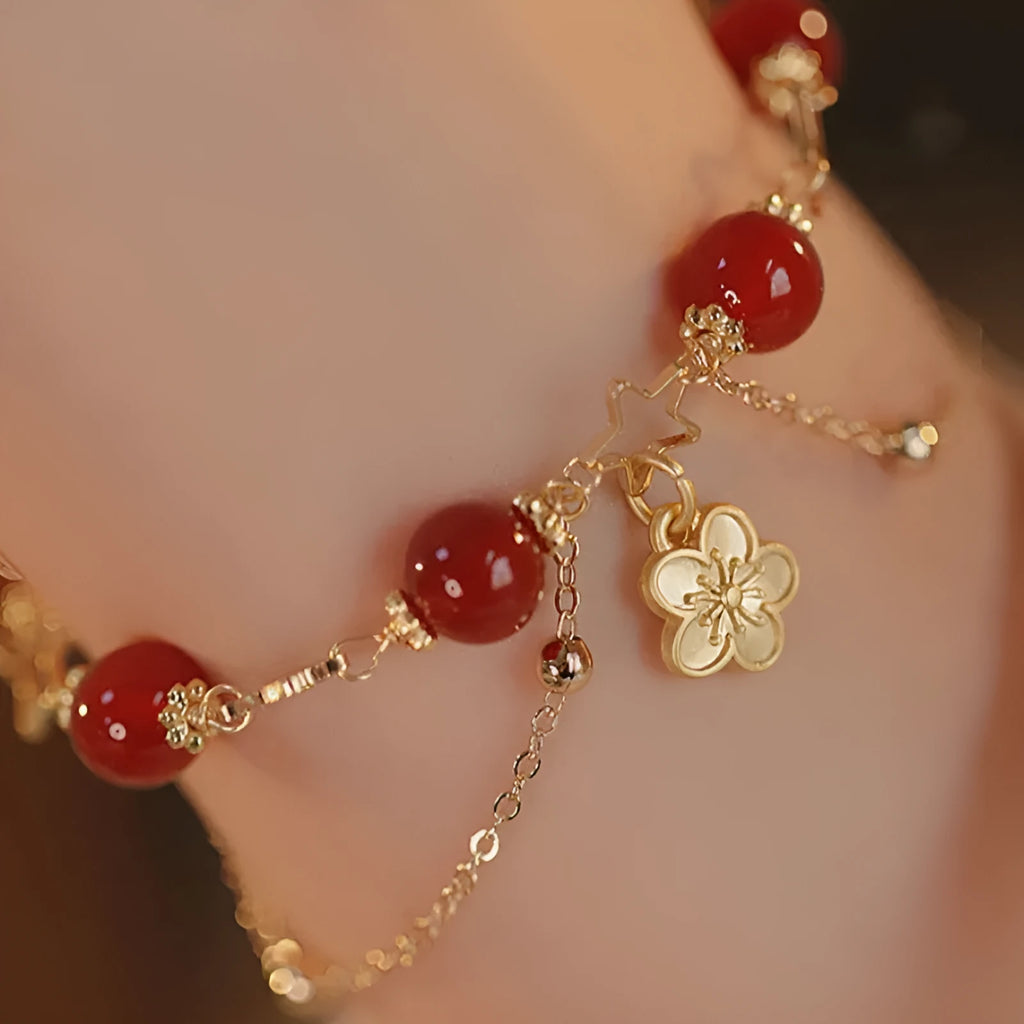 Women's double layer red agate bracelet with peach blossom flower elements and ethnic design