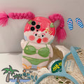 Pink and green silicone iPhone case with a cartoon girl in a swimsuit and braid design.