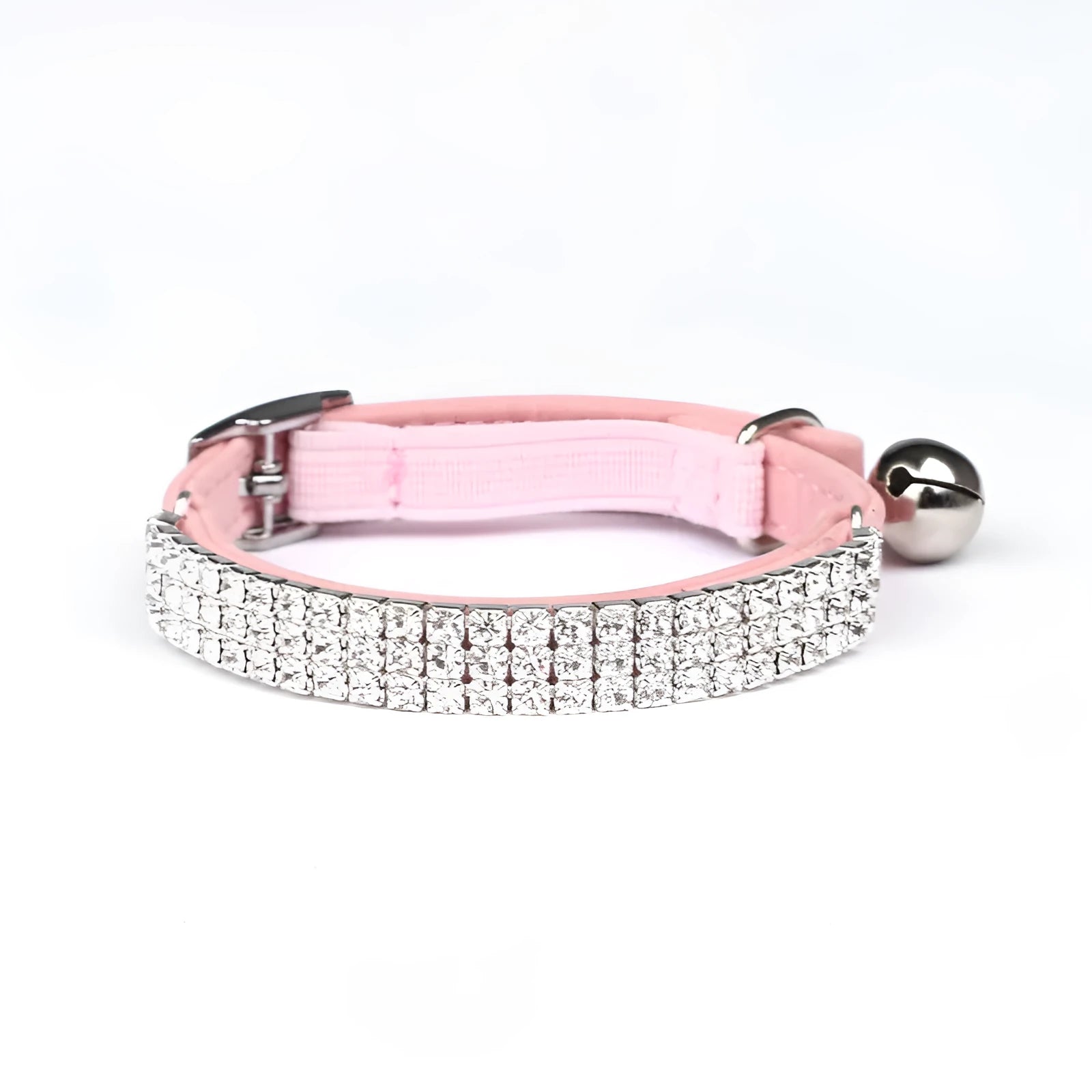 A soft red velvet cat collar with a line of rhinestones, showing the adjustable buckle.