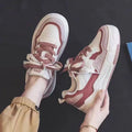 Beige and pink low-top sneakers with rubber soles and imitation leather lining