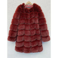 Women's thick black artificial fur coat with regular sleeves on a model.
