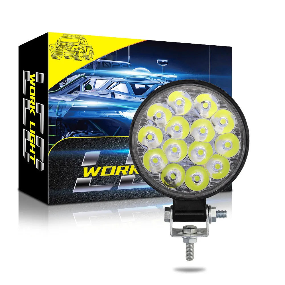 White aluminium LED work light unit with IP67 waterproof rating, suitable for car and off-road vehicle mounting.