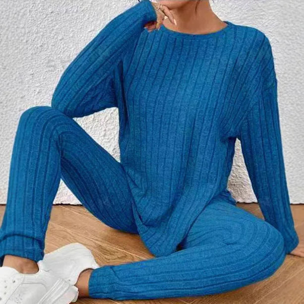 Black sunken stripe two-piece lounge set for women, showing top and pants.