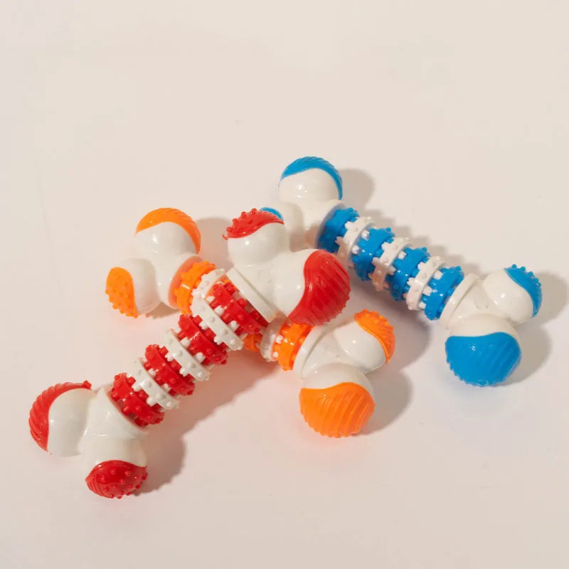 Blue bone-shaped rubber dog toy with a treat holder in the centre, shown next to dog biscuits.