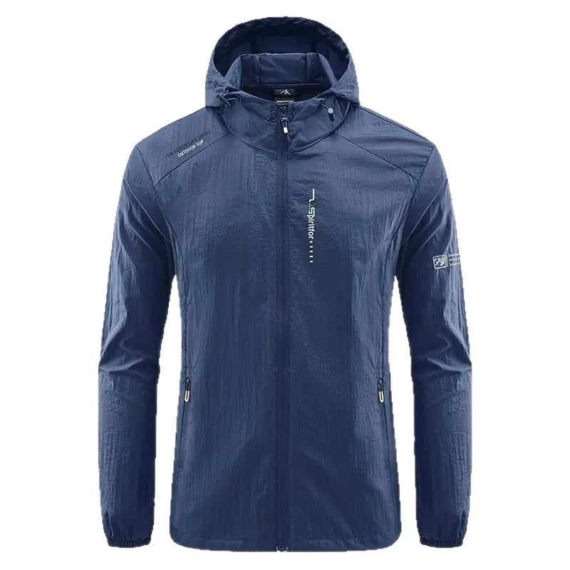 Man wearing a loose-fit light grey hooded nylon jacket for summer sun protection.