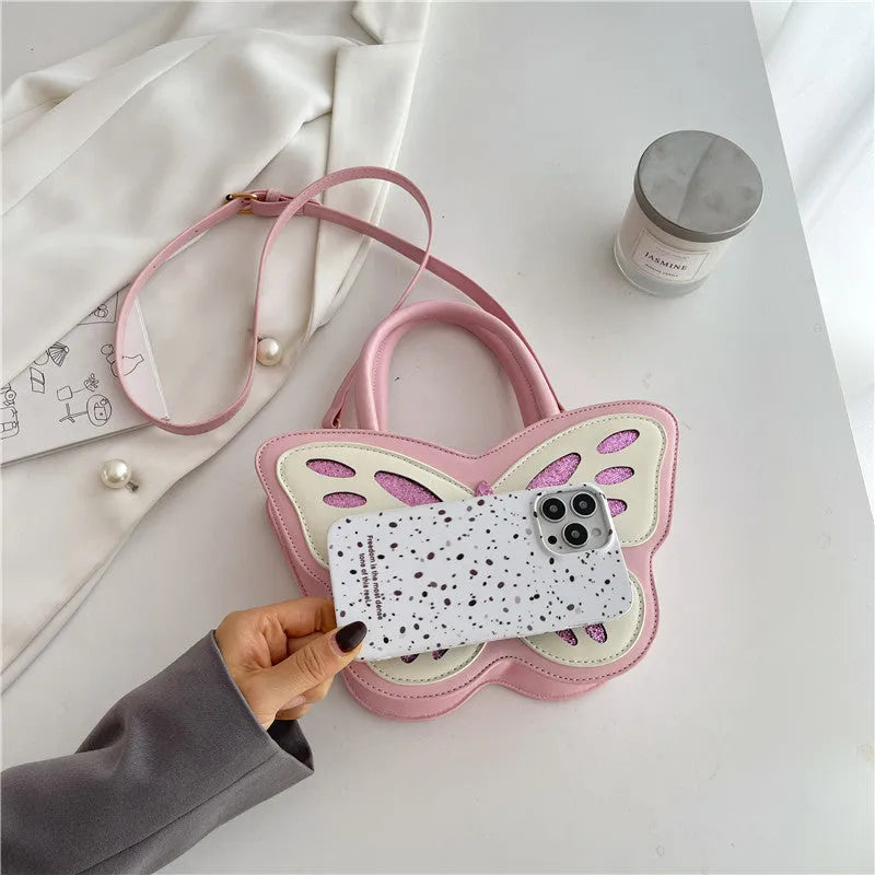 Small square white PU crossbody bag with contrast colour detailing on a model.