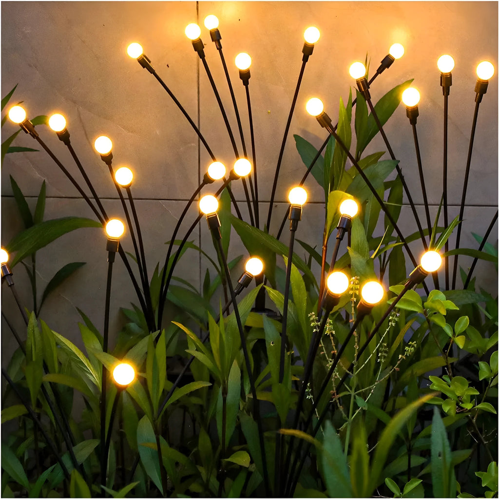 Solar-powered LED firefly ground lamp with multiple light heads for garden pathway illumination