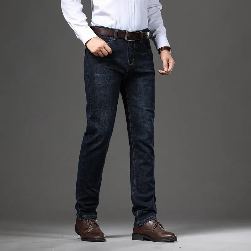 Women's straight leg stretch jeans in K276 blue denim, shown in a loose fit on a model.