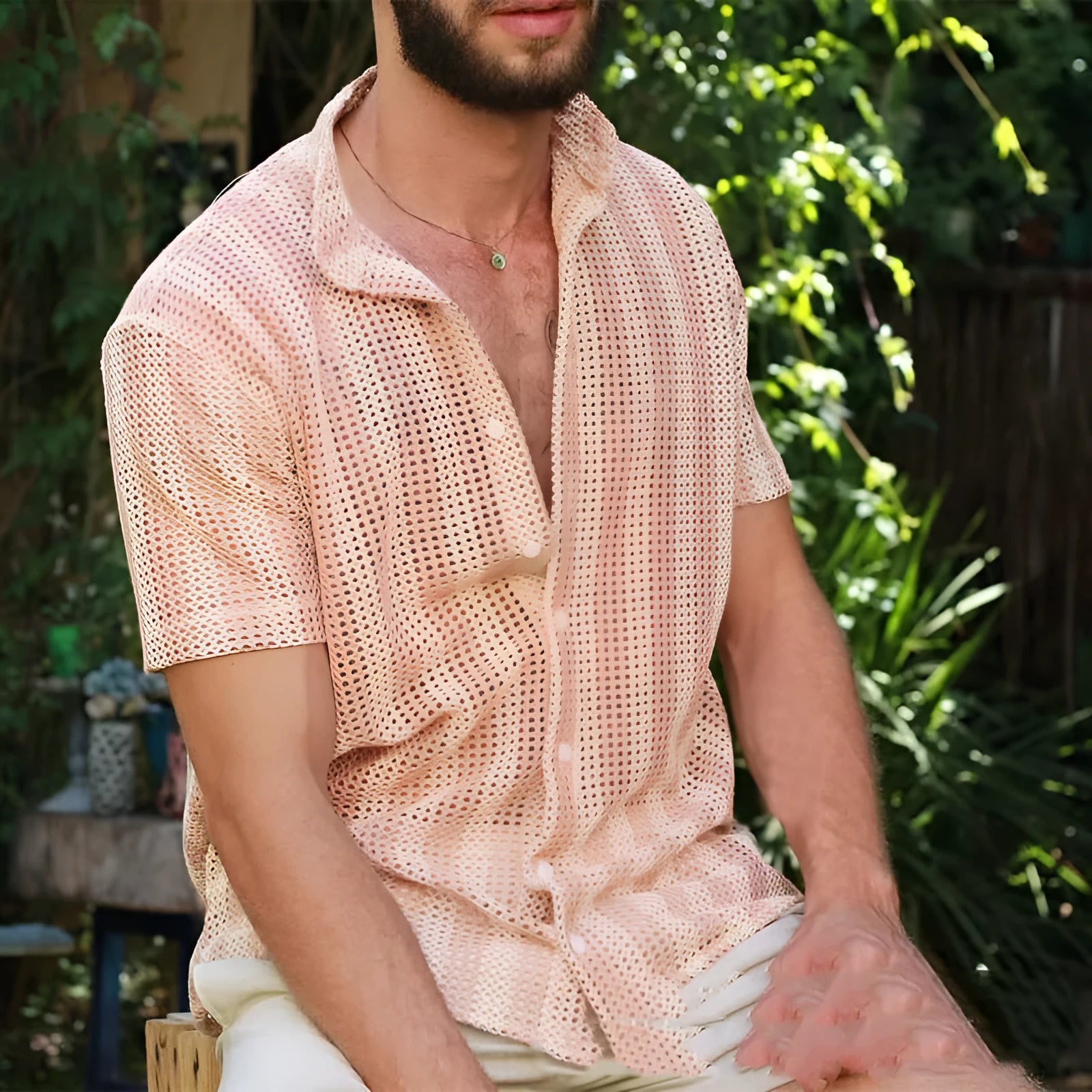 Men's pink waffle-textured short-sleeved cardigan shirt on hanger