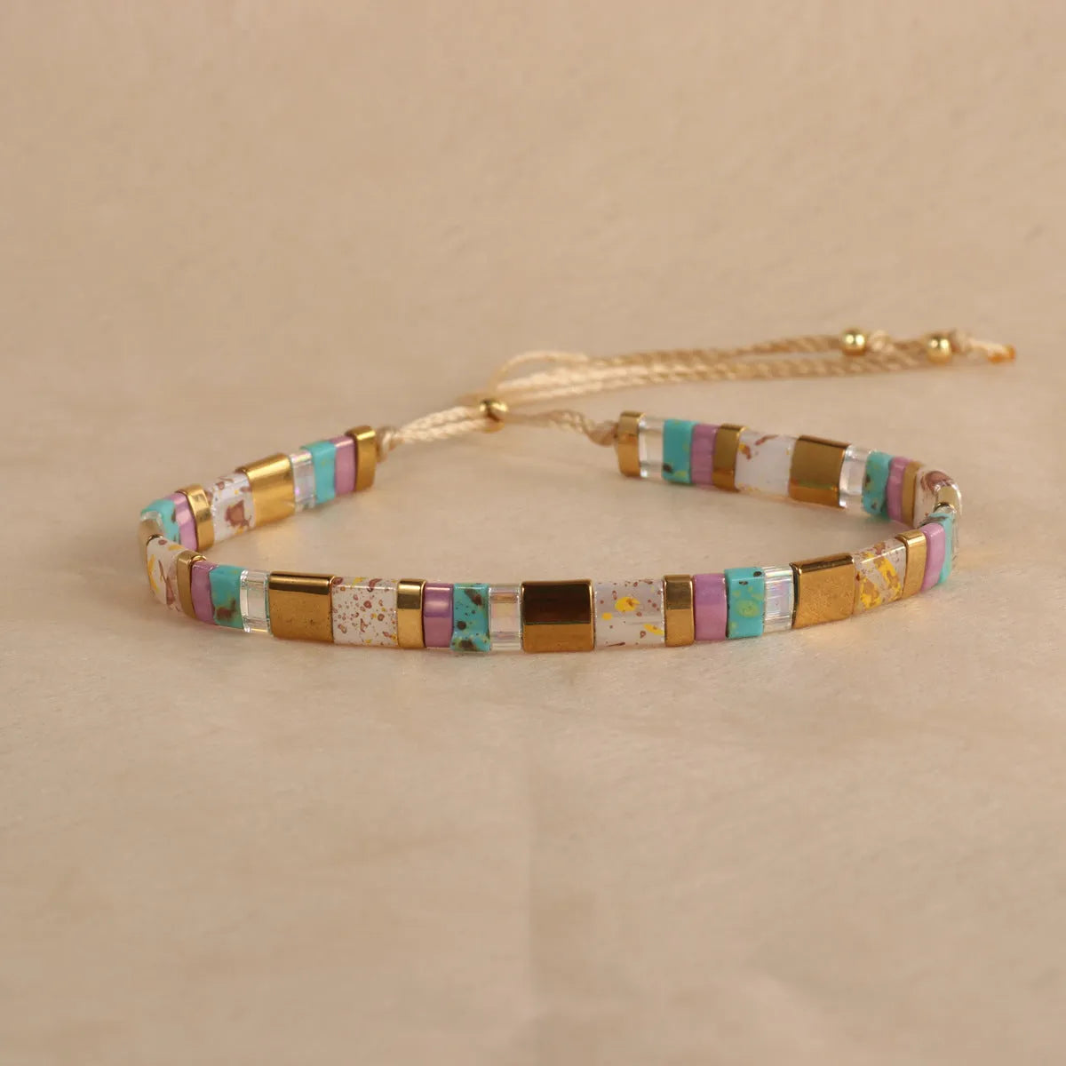 Geometric glass bead bracelet with pull bead closure in five colour options